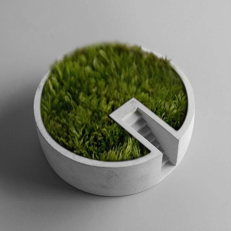 Circular Cement Plants Decor (No Plants) – Desktop Decor
Functional Elegance: More than just a visual treat, this moss decor is thoughtfully designed with a flat surface to hold your cherished collectibles, stationary, or